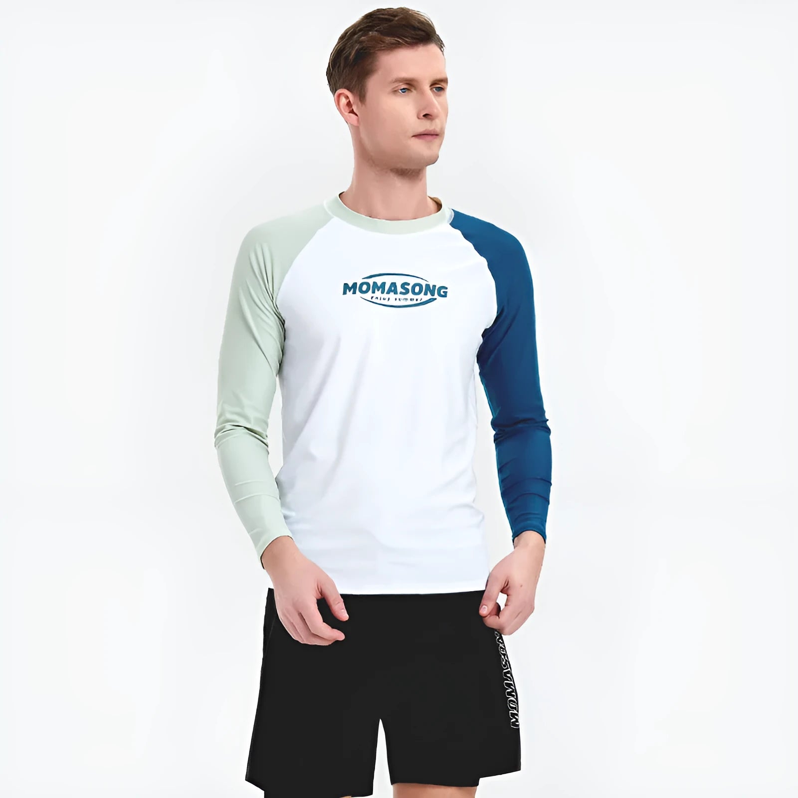 Man wearing a white long-sleeved swim top and matching swim trunks set for beach or pool.