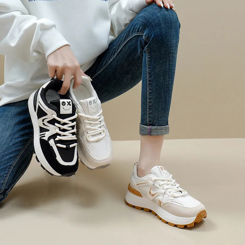 Women's black platform casual shoes with flat heel, round toe, and lace-up front on a white background.