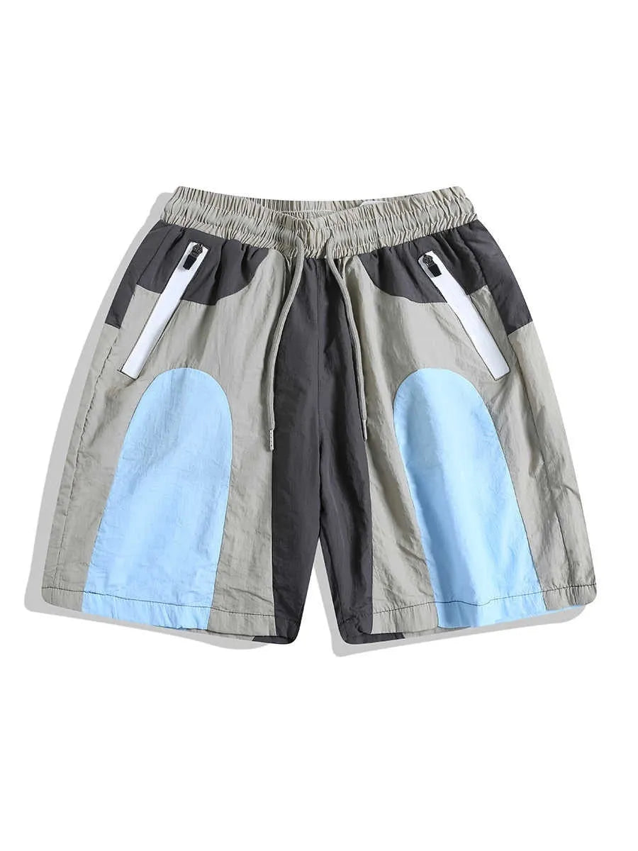 Blue patchwork men's beach shorts with elastic waist and above-knee length for outdoor sports