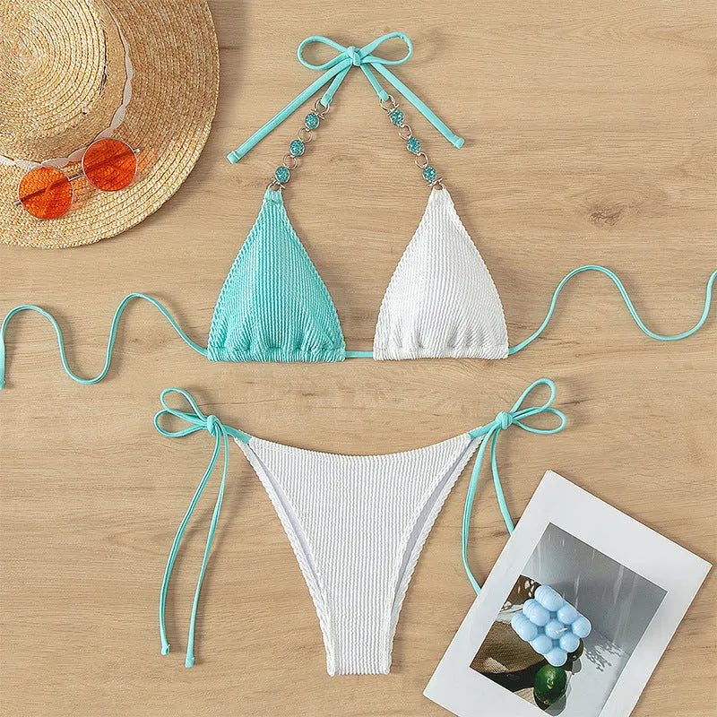 Women's lace-up swimsuit with colour matching panels and decorative pearl chain detail