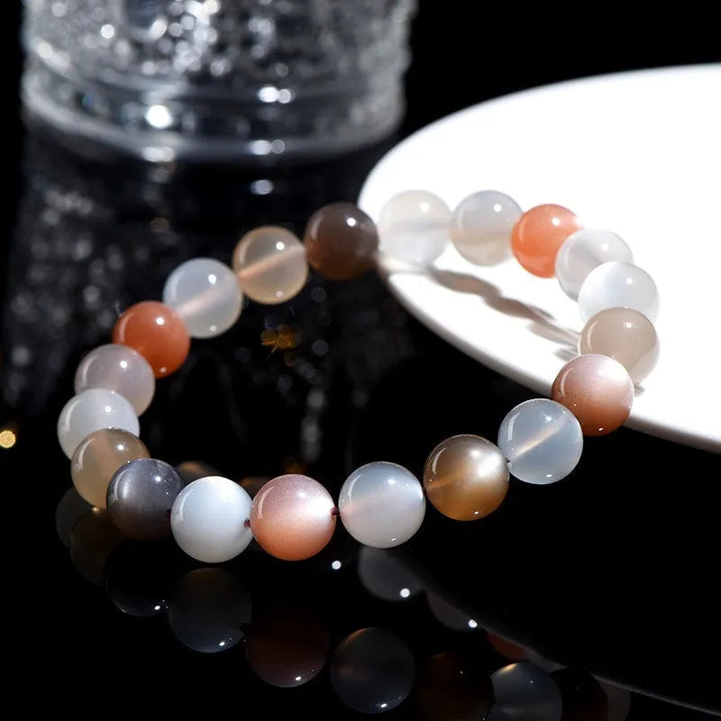 Natural colourful moon light moonstone duobao bracelet with 8mm beads on an adjustable band.