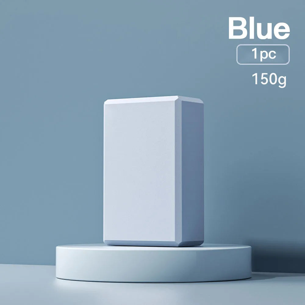 Blue EVA foam yoga brick with hexagonal ridges on surface
