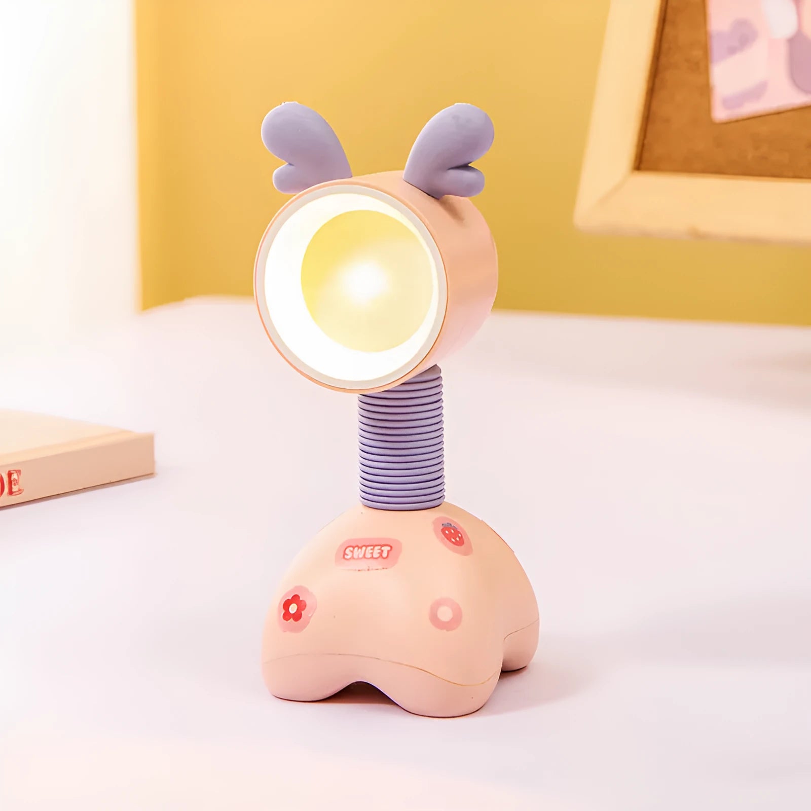 DIY magnetic cartoon small night lamp with multi-angle adjustable lighting on desktop