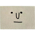 Square PVC floor mat with a large cartoon face Mr Big Nose design and geometric pattern on a grey background.