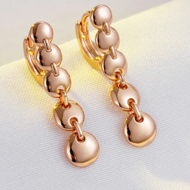A pair of gold-coloured retro long circle earrings with a woven texture, for pierced ears.