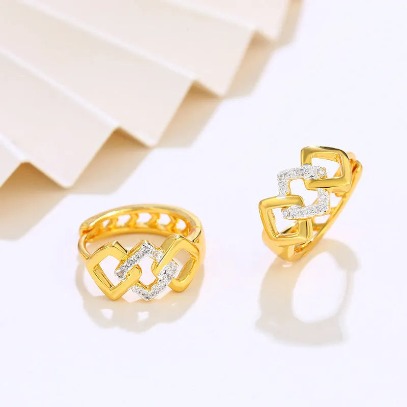 Geometric hollow-out gold electroplated ear clip earrings showing colour separation detail