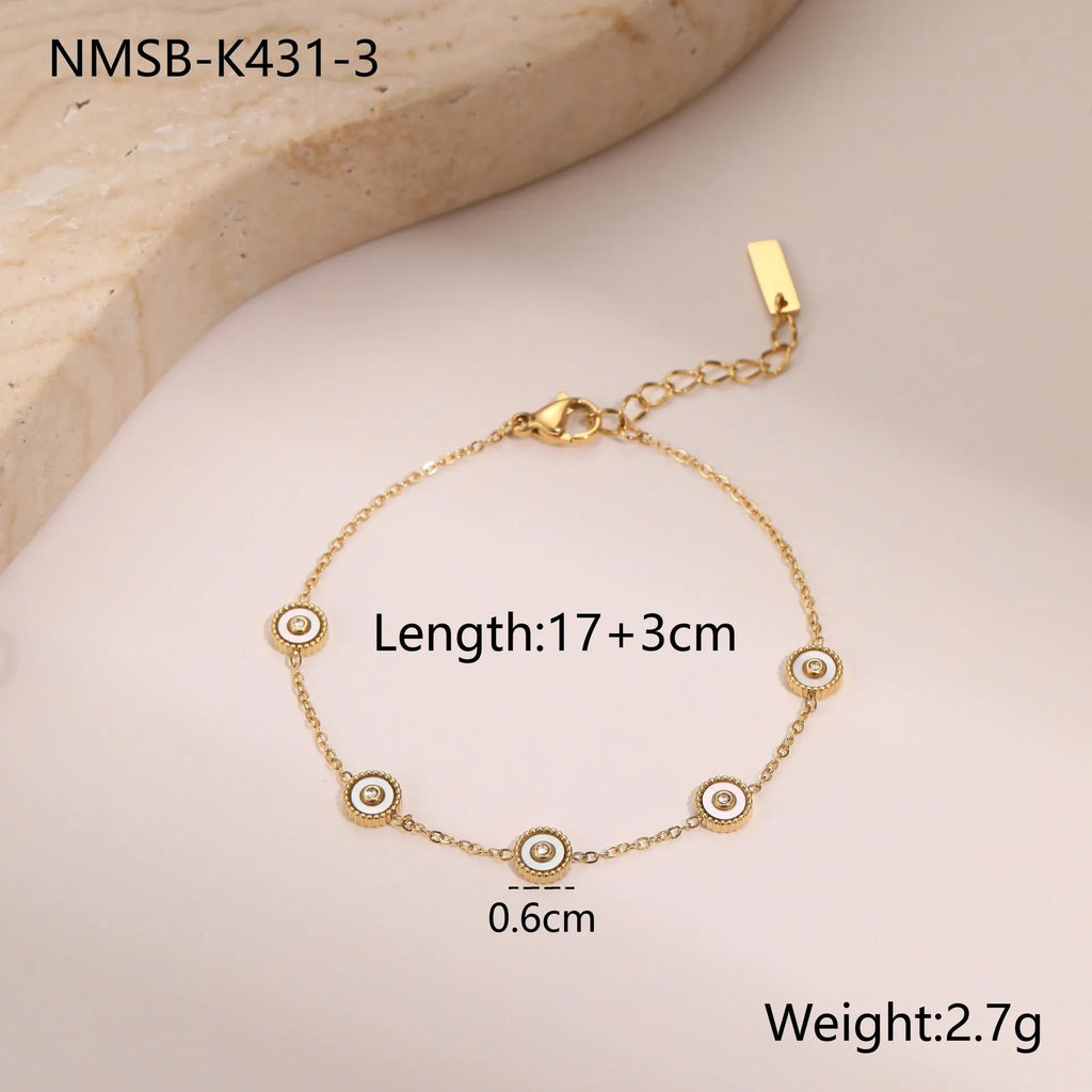 Women's stainless steel bracelet and necklace set with 18K gold plating and geometric design.