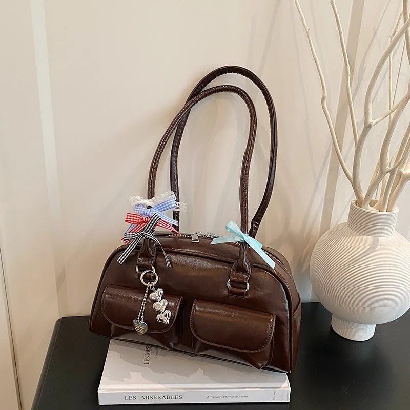 Retro pillow-shaped women's handbag in PU leather with double shoulder straps