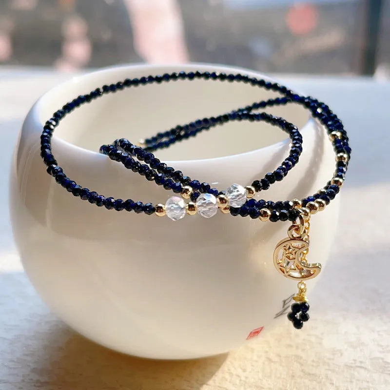 Blue sand stone three-ring multi-layer bracelet with gold-coloured metal detailing and cut stone texture