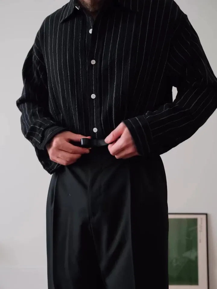 Black pinstriped polyester button-down shirt for men on a hanger, showing regular fit.
