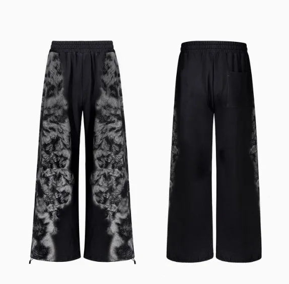 Three-piece streetwear co-ord set showing hoodie, loose trousers and seven-inch shorts with printed collage design