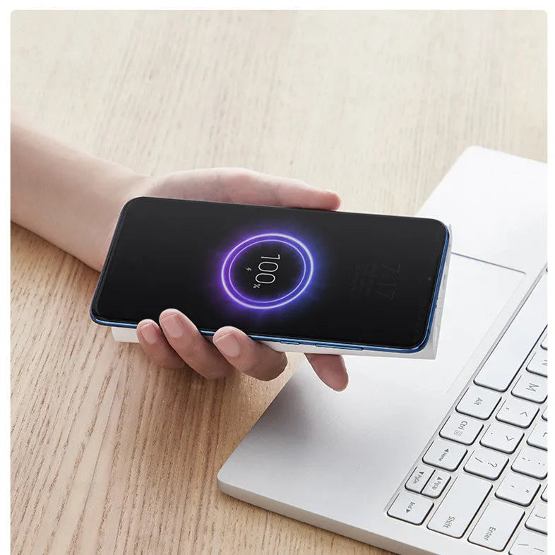 White and black large capacity 10000mAh power bank with USB-C port and wireless charging symbol.