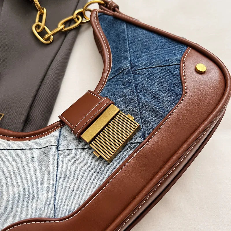 Brown denim women's shoulder bag with chain straps and bucket design showing phone compartment