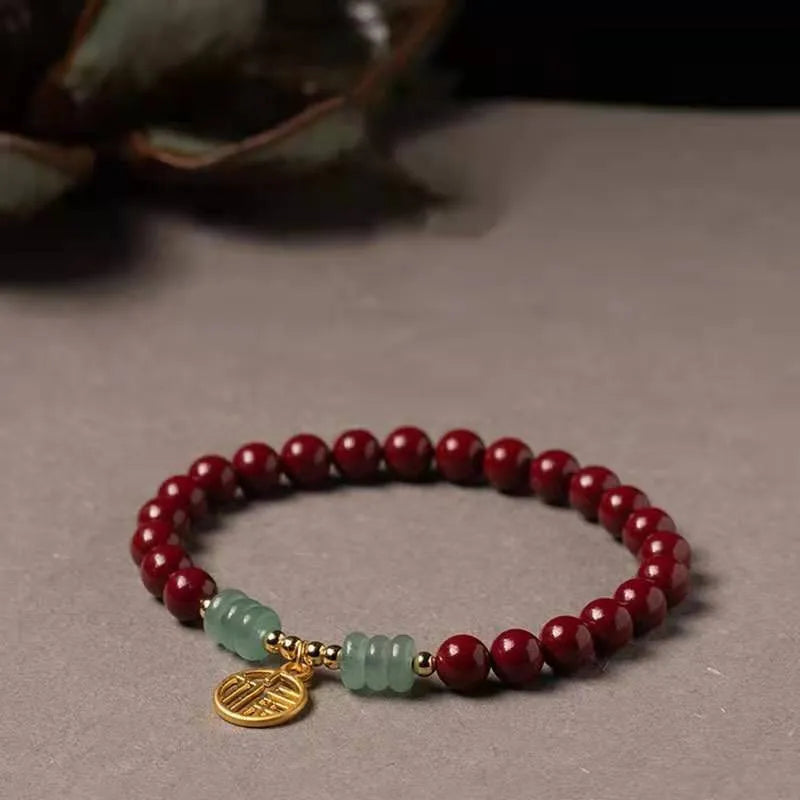 Close-up of a handcrafted wave-shaped cinnabar and copper bead bracelet in national style.