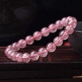 Women's strawberry quartz bracelet with polished crystal beads in choice of 6mm, 8mm or 10mm sizes