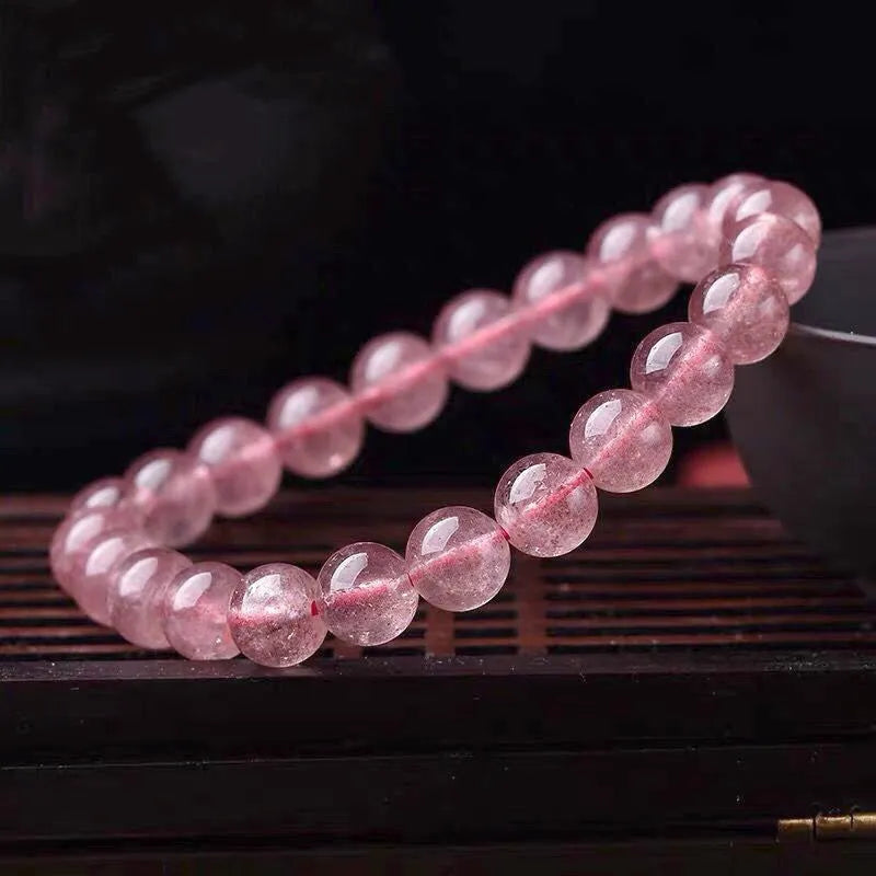 Women's strawberry quartz bracelet with polished crystal beads in choice of 6mm, 8mm or 10mm sizes