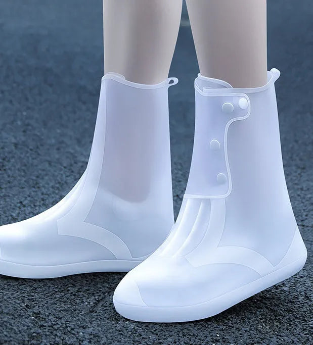 White high-top PVC waterproof reusable shoe covers for women, shown alongside size chart