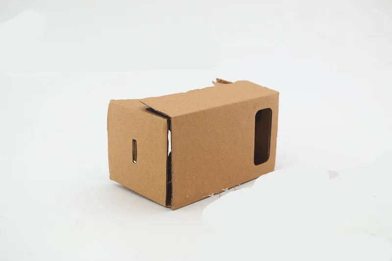 Pink and white VR cardboard glasses viewer for 6-inch smartphones with adjustable head strap.