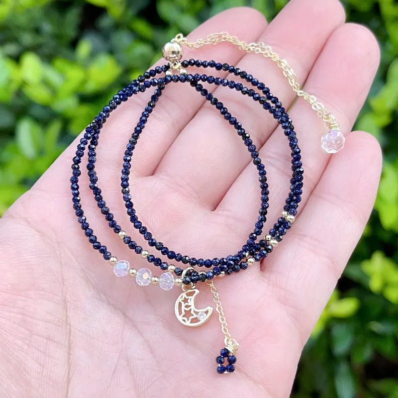 Blue sand stone three-ring multi-layer bracelet with gold-coloured metal detailing and cut stone texture