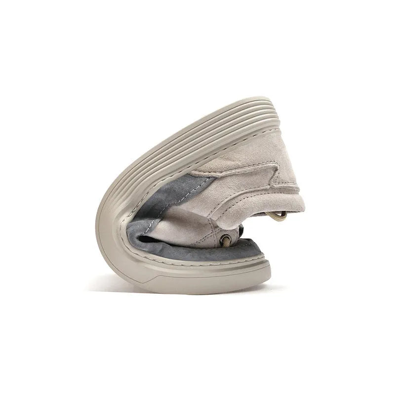 Men's grey casual skate shoes with pigskin upper and rubber sole, shown with front lace-up design and round toe