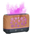 Colourful snowflake pattern wood grain aromatherapy humidifier with flame effect lighting on desktop