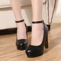 Women's chunky heel high shoes in black and white colours with a round toe and rubber sole.
