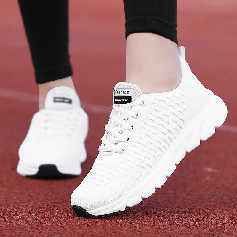 Women's running shoes with mesh upper in black, pink, or white colour options