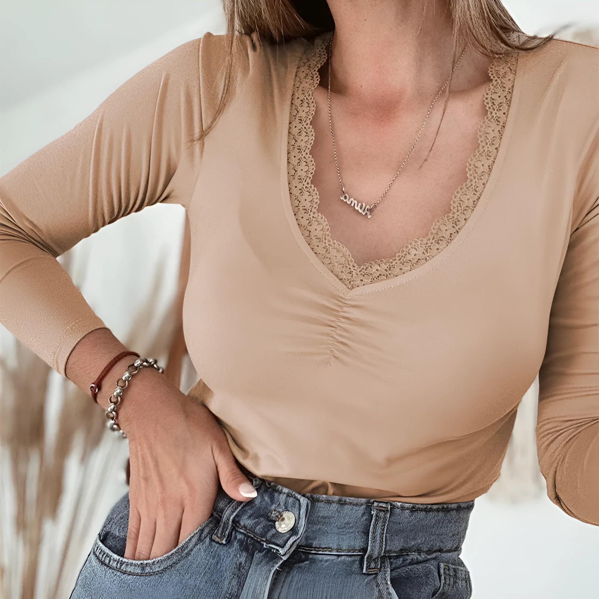 Women's solid colour long sleeve casual top with lace trim detail in slim fit design