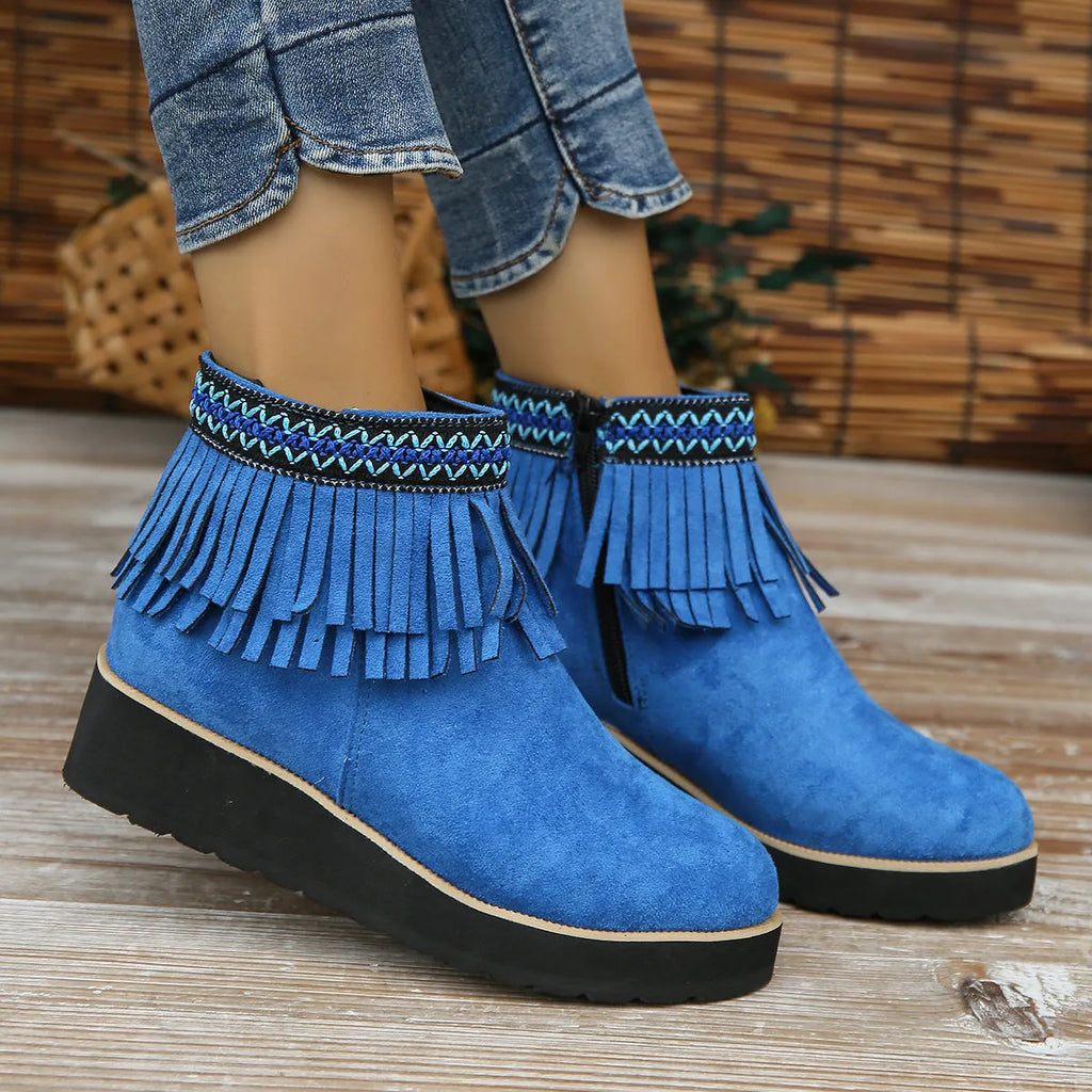 Women's dark brown suede wedge ankle boots with a side zip and decorative tassel.