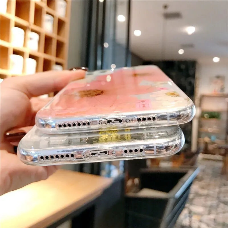 Floral TPU phone case with large pink flower design on back, shown fitted on an iPhone.