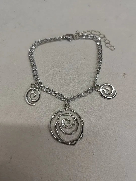 Spiral donut design women's jewellery set showing matching necklace, bracelet, and ear hooks in gold electroplated finish