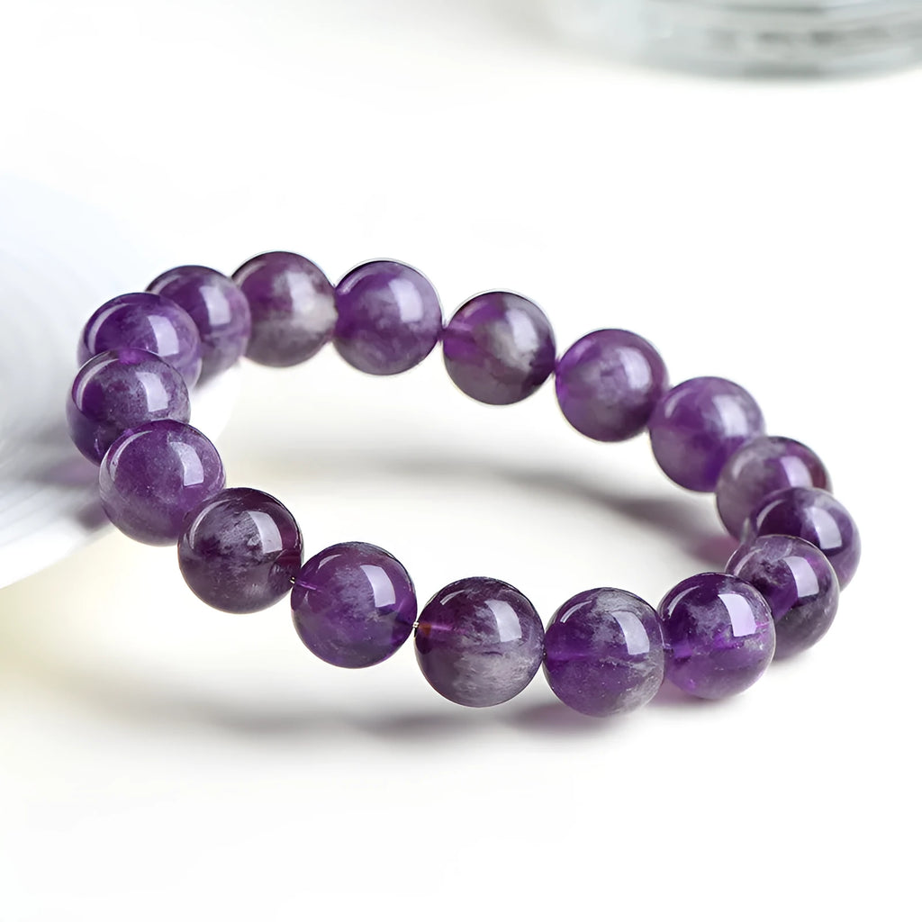 Natural feather amethyst bracelet with purple scattered beads and Ruyi design element.