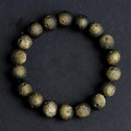 Natural obsidian crater ball bracelet with hand-ground meteorite beads in gold or silver colour options