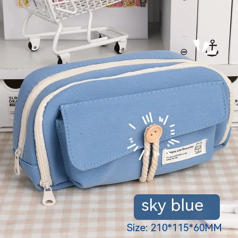 Korean-style canvas pencil case in green, beige, blue or grey holding multiple pens
