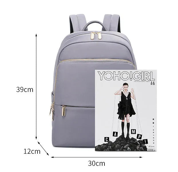 Large capacity black Oxford cloth women's backpack with multiple compartments.