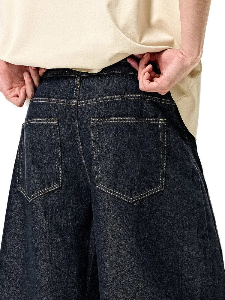 Men's wide leg denim trousers in original cow colour showing mid waist and straight leg design