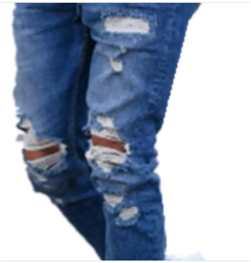 Deep blue men's jeans with distressed holes on the knees, laid flat.