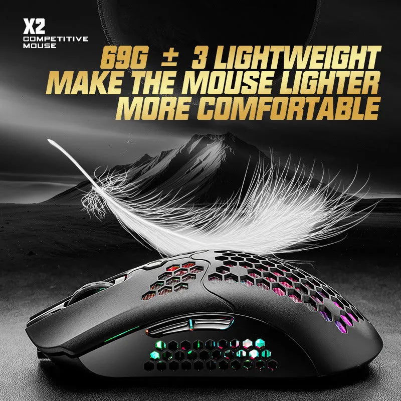 Free Wolf X2 wireless RGB gaming mouse with honeycomb shell in yellow colour on a desk.