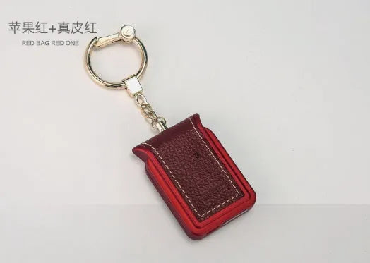 Bluetooth dual SIM adapter keychain for iOS with Nano SIM slot and Micro USB port.