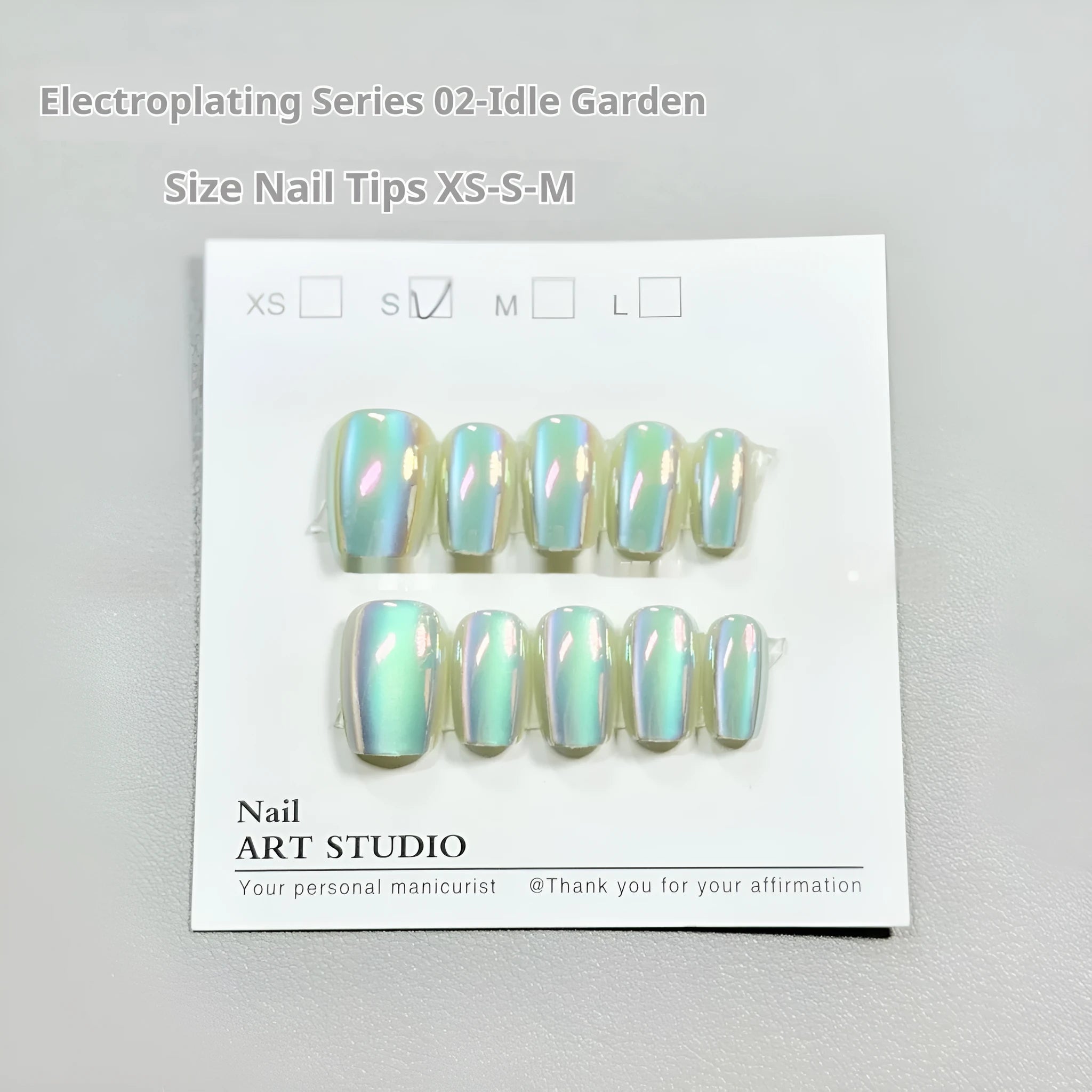 Electroplated Cat's Eye gel nails with Aurora armour effect in short ladder sizes