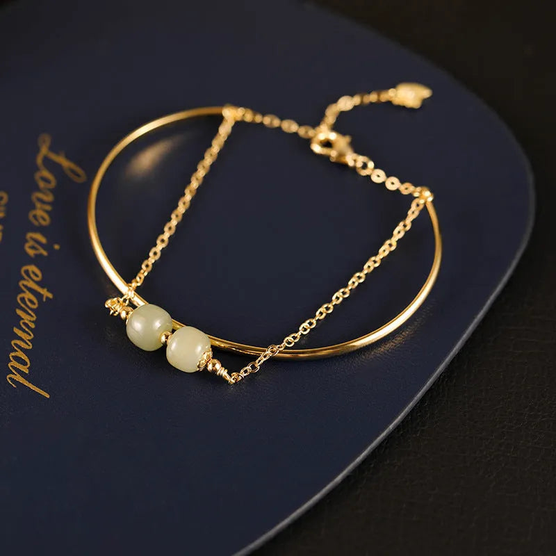 Women's jade lucky beads bracelet with gold inlay in single, double, and three bead versions.