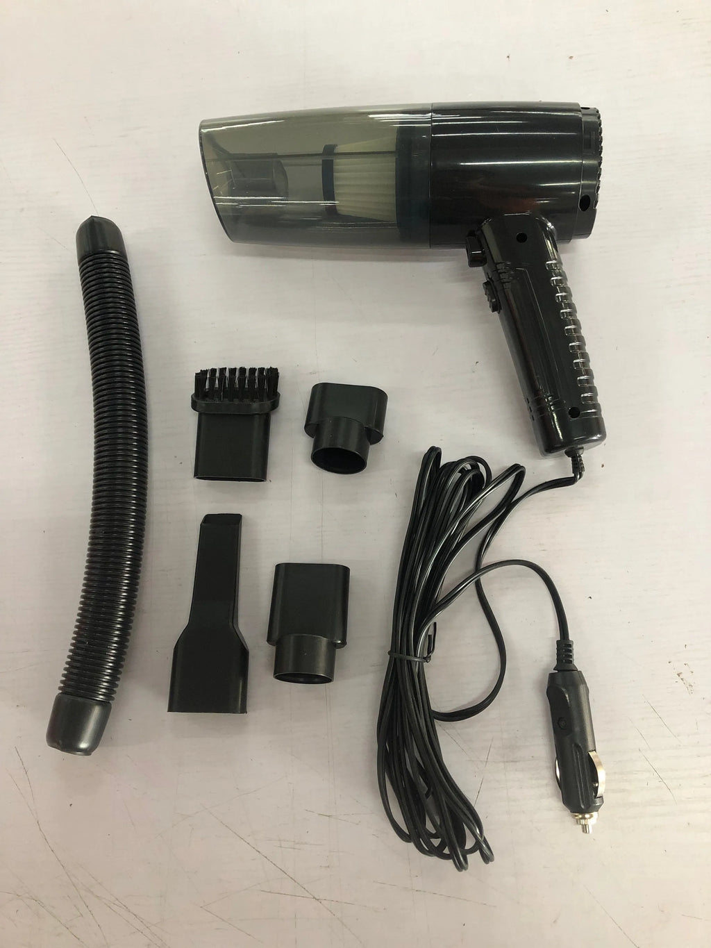 Portable car vacuum cleaner with accessories in black or white colour options