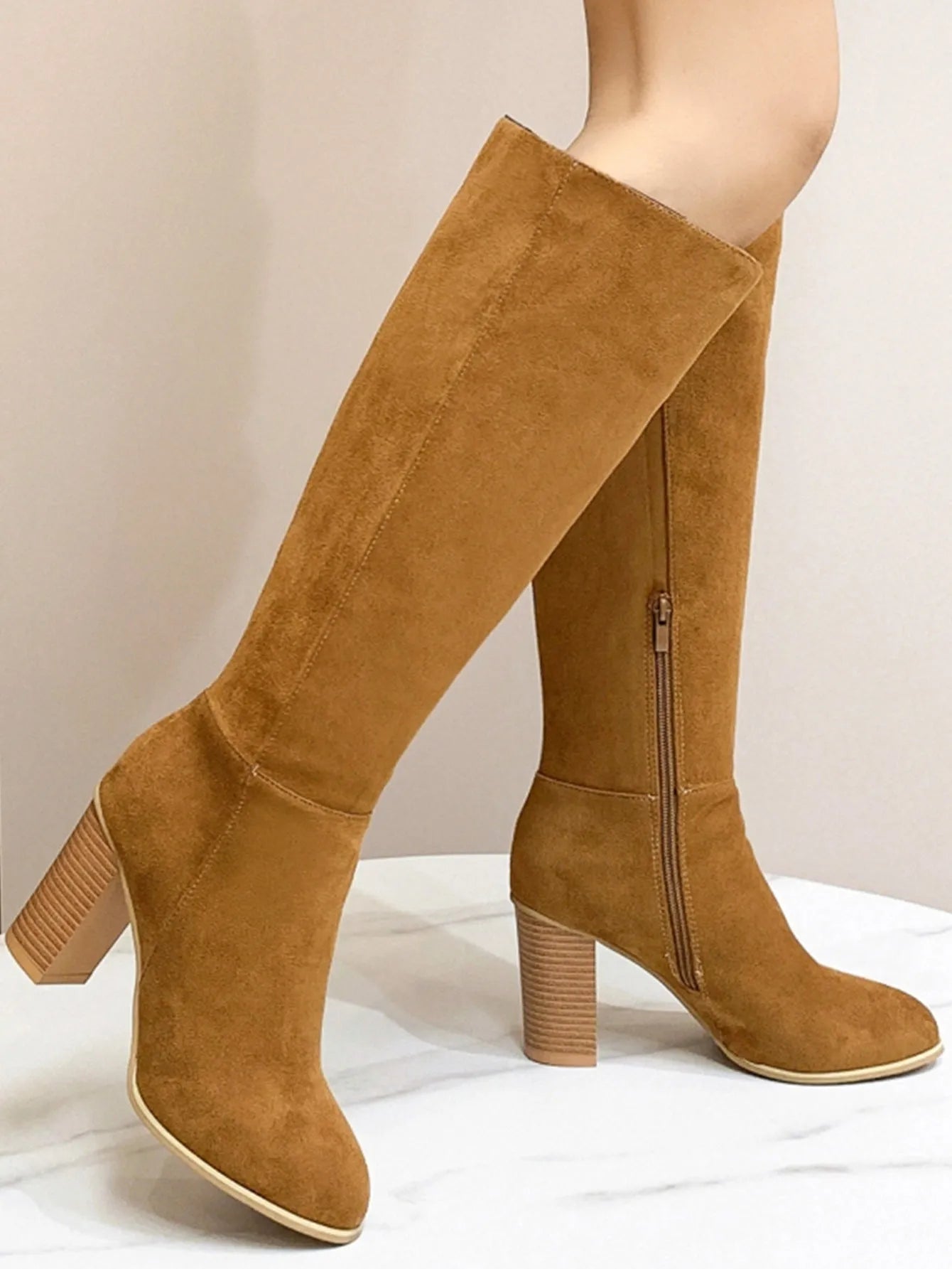 Women's black square toe high heel fashion boots made from artificial PU, shown from the side.