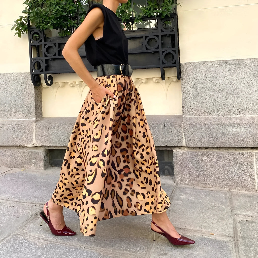 Brown leopard print women's A-line long skirt on hanger showing full length and animal pattern design