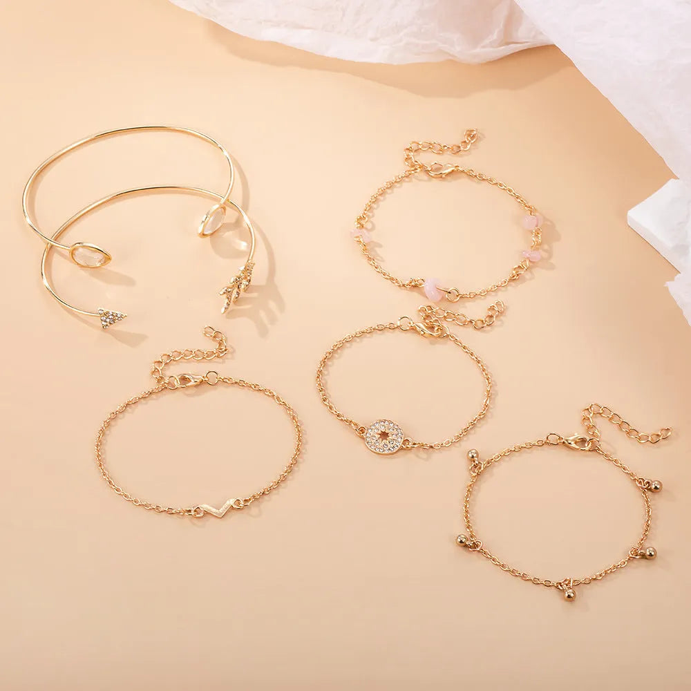 Gold-coloured six-piece zinc alloy bracelet set with water drop, V-shaped, arrow, drill and spot designs