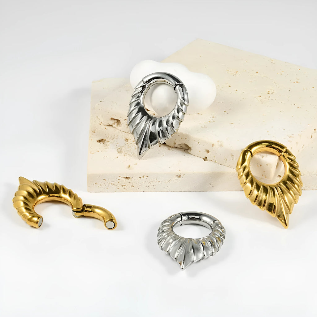 Stainless steel drop-shaped ear extender with totem design in four style variations