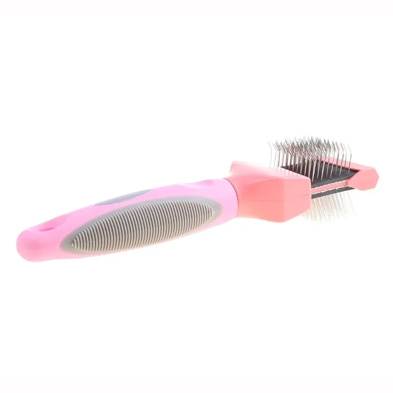 Blue double-sided dog grooming brush with stainless steel pins and ergonomic non-slip handle on a white background.