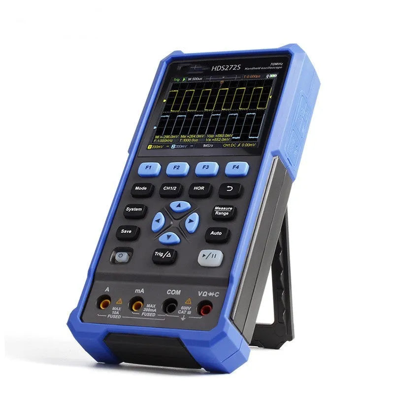 Handheld digital oscilloscope with probe on workbench for automotive electrical testing.
