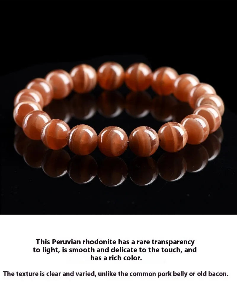 Natural old mine rhodochrosite round bead bracelet with ruyi design element.