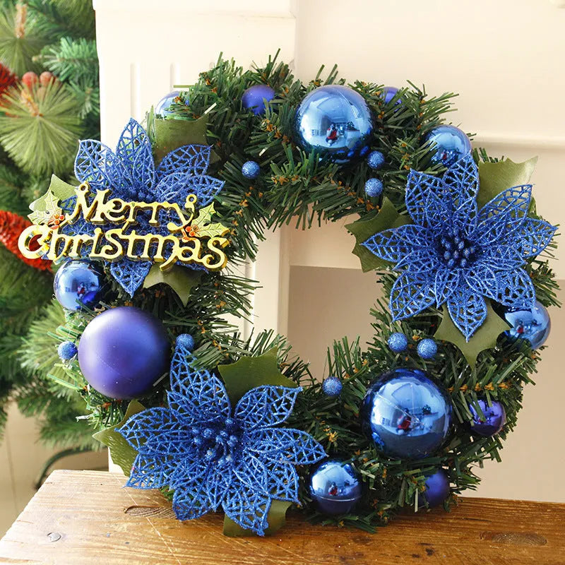 Multicolour plastic Christmas wreath with a 30cm diameter, hung on a door.